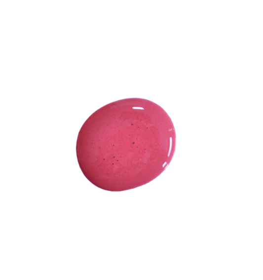 a drop of mulberry milk paint on a solid white background.