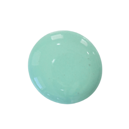 a drop of patina milk paint on a plain white background.