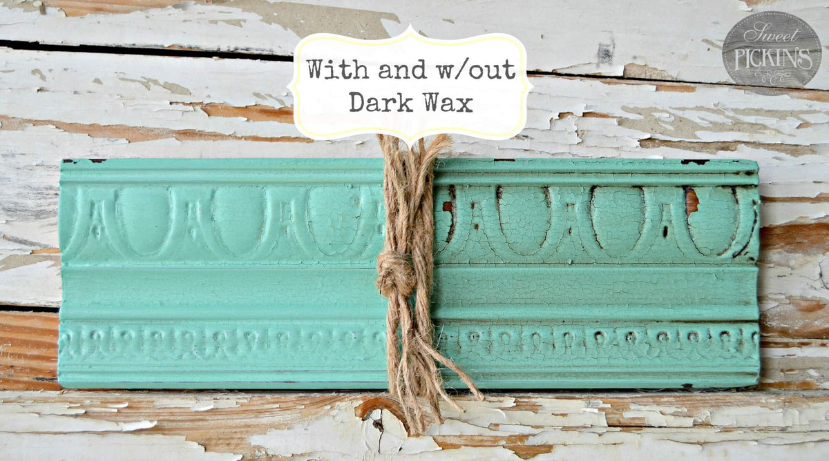 Teal decorative item with twine on a wooden background