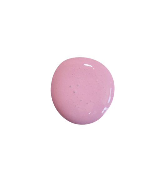 a drop of plumberry milk paint on a solid white background.