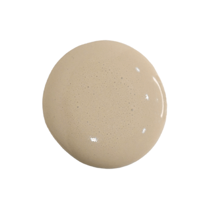 a drop of proper milk paint on a white background