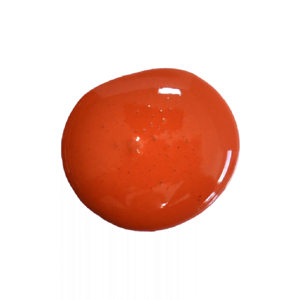a drop of red wagon milk paint on a white background