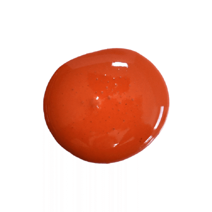 a drop of red wagon milk paint on a white background