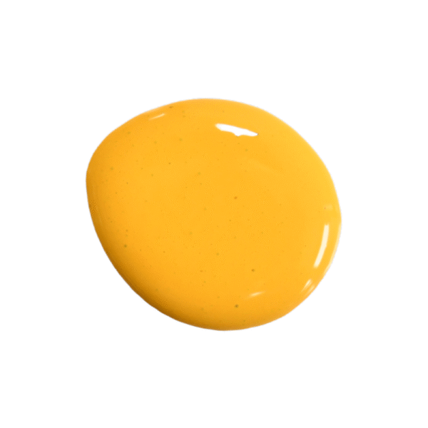 a drop of sunflower milk paint on a solid white background.