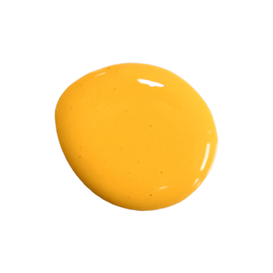 a drop of sunflower milk paint on a solid white background.