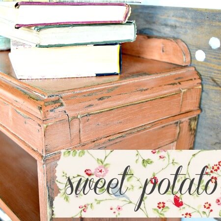 Wooden desk with books on top, labeled 'sweet potato' with floral design