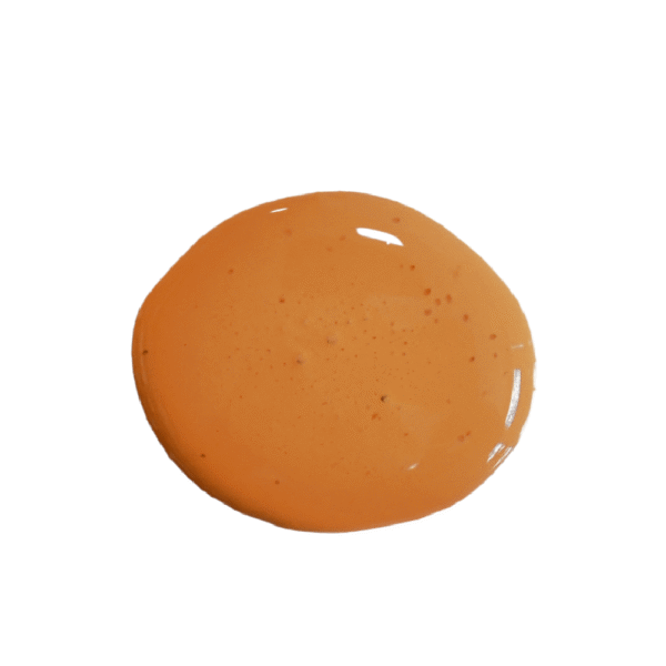 a drop of sweet potato milk paint on a solid white background.