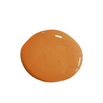 a drop of sweet potato milk paint on a solid white background.