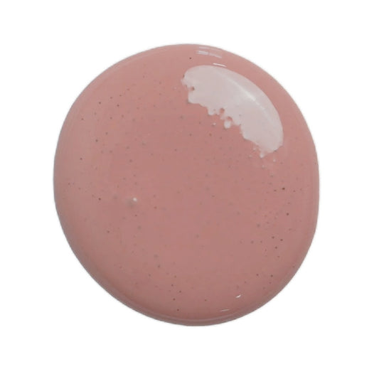 a drop of trellis rose milk paint on a white background