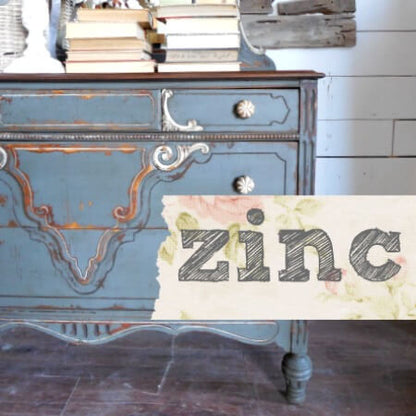 Decorative furniture with 'zinc' branding in the foreground