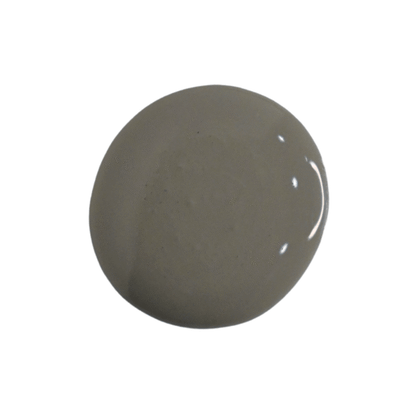 a drop of zinc milk paint on a white background
