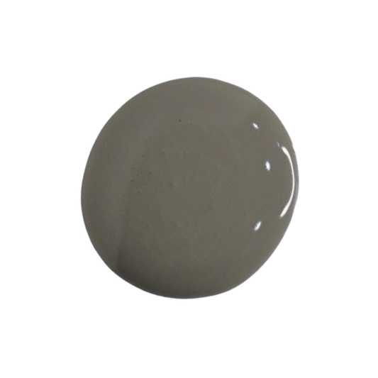 a drop of zinc milk paint on a white background